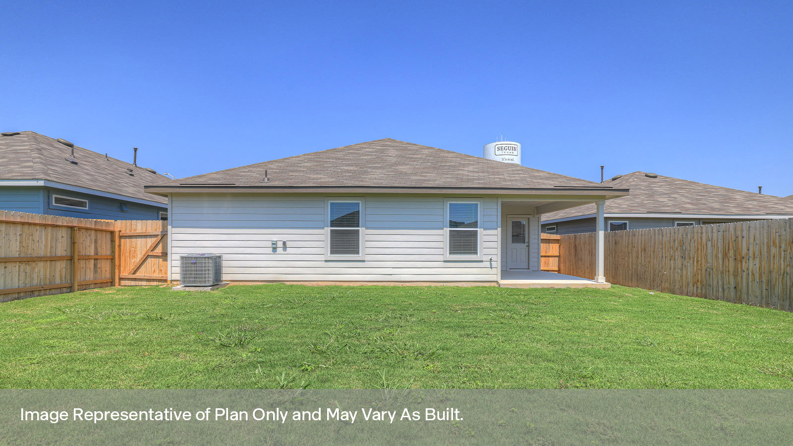 Covered patio with fully sodded backyard and privacy fence.