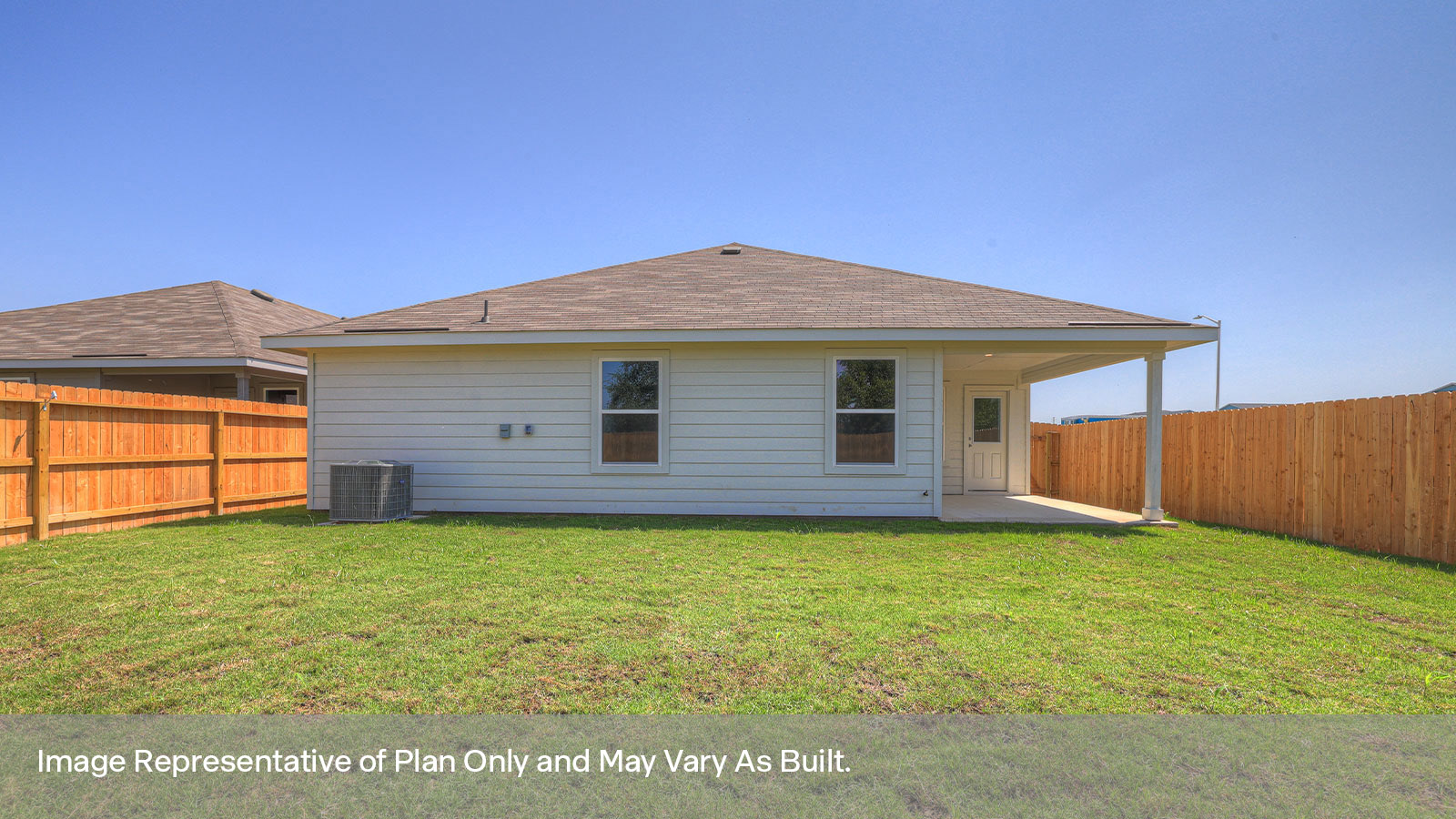 Covered patio with fully sodded backyard and privacy fence.