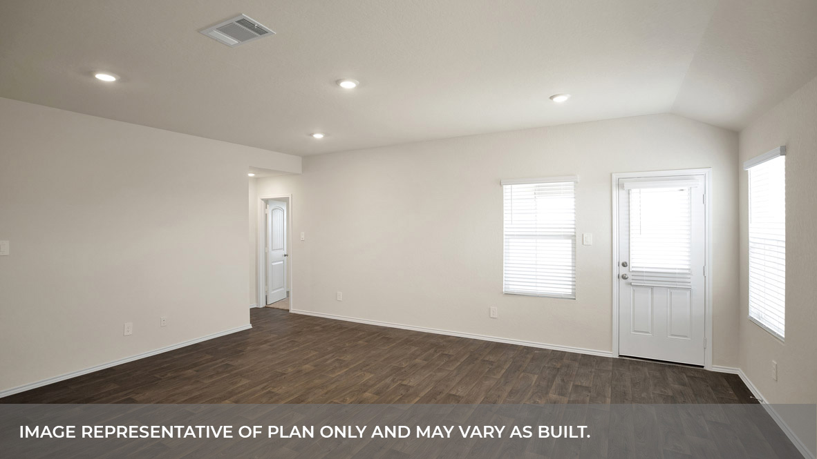 Living room with vinyl flooring, two windows, and a half lite exterior door.