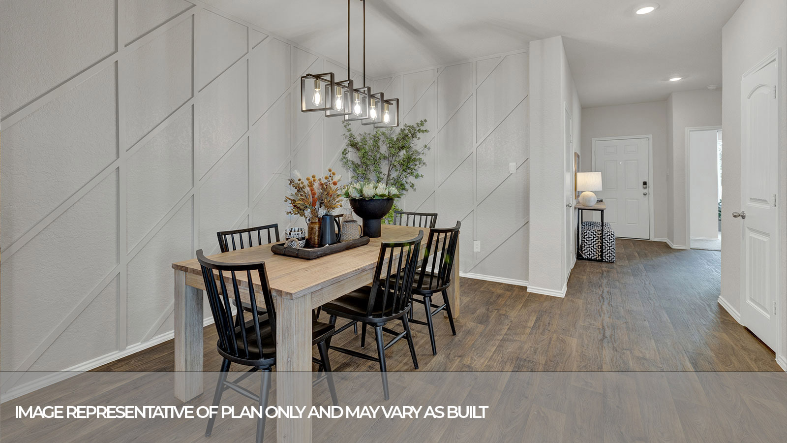 Dining with vinyl flooring and entry hallway.