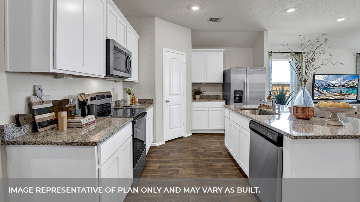 Kitchen with granite countertops and appliances.
