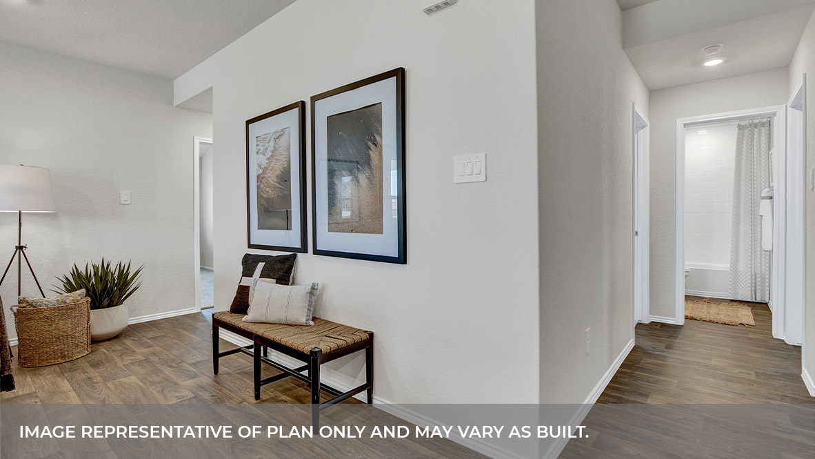 Hallway with vinyl flooring.