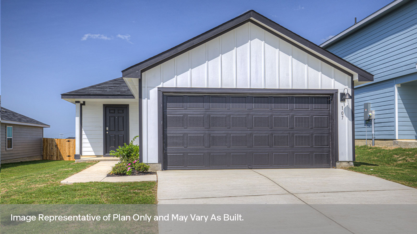 Single-story farmhouse with 2 car garage.