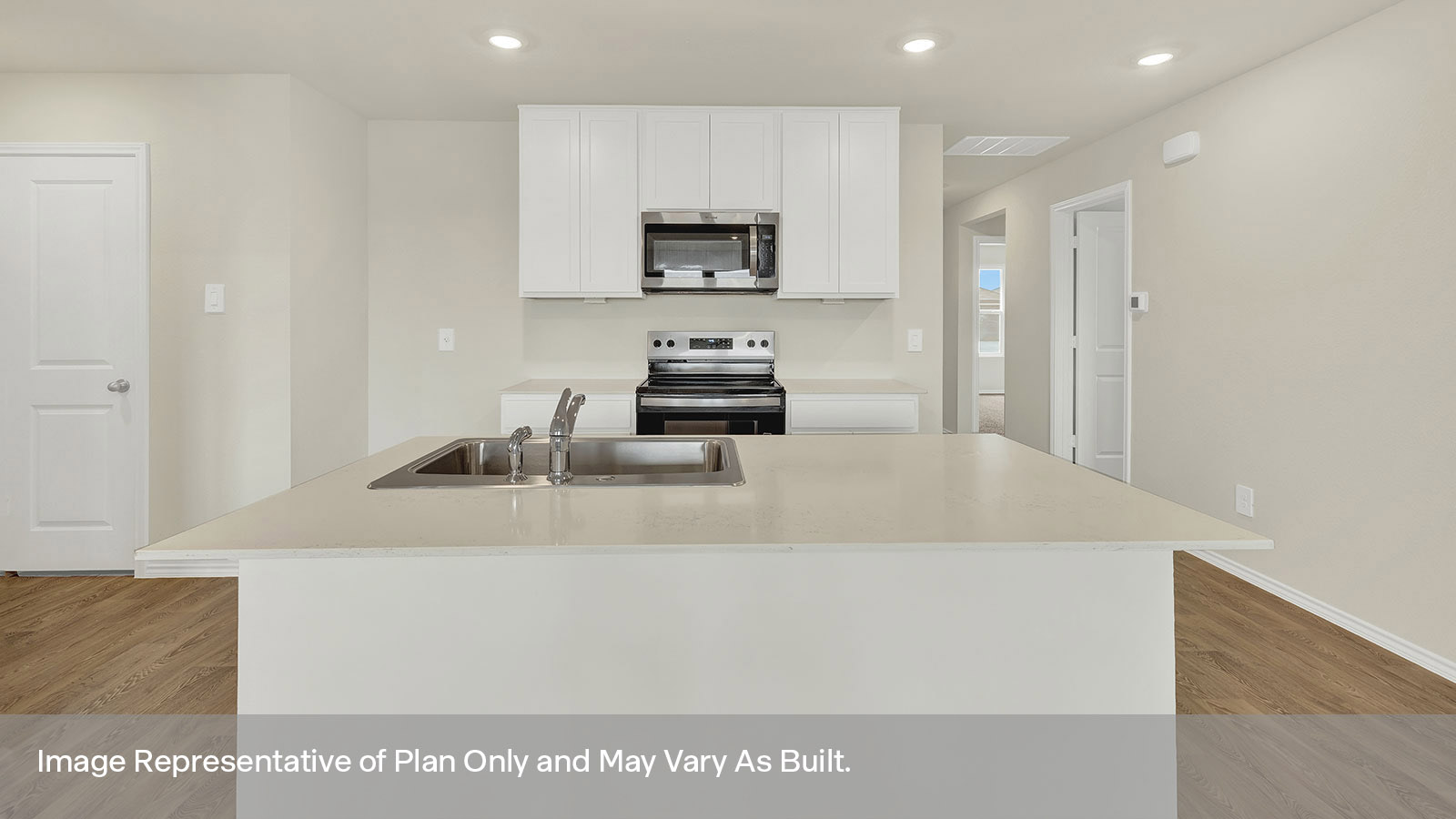 Kitchen with kitchen island and white cabinets.