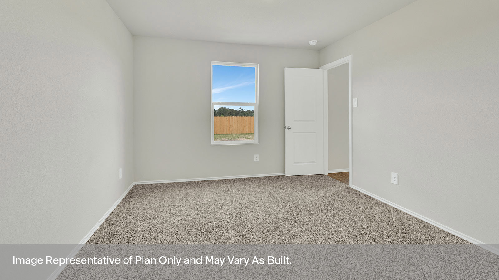 Main bedroom with carpeting and one window.