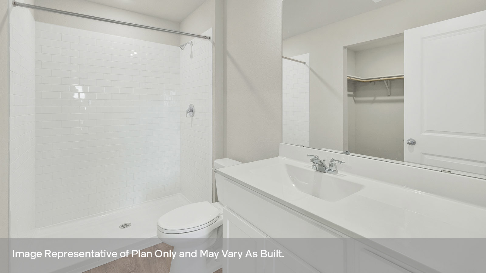 Main bathroom with vanity, toilet, and shower.