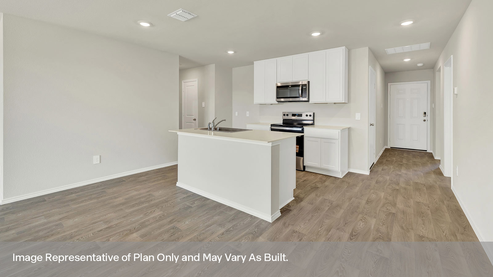 Entry hallway with kitchen and kitchen island.
