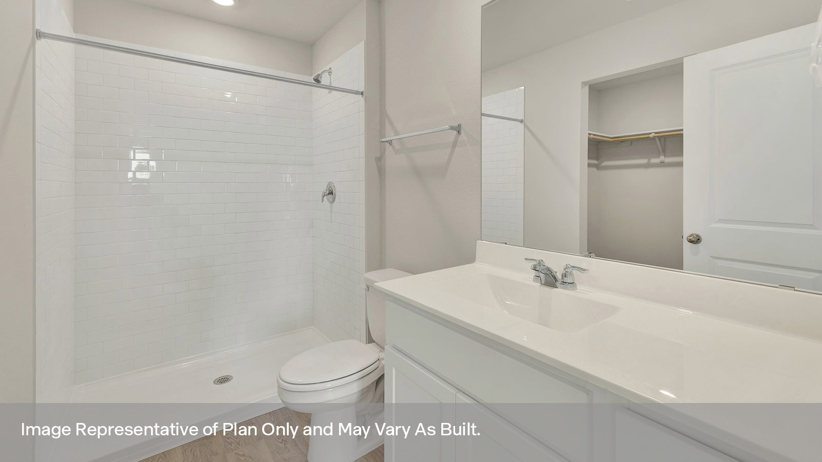 Main bathroom with vanity, toilet, and shower.