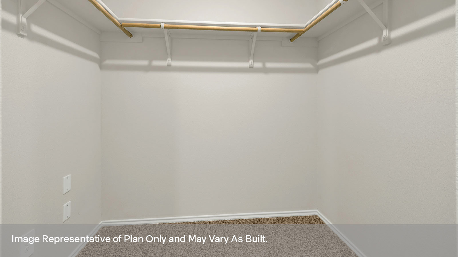 Closet with carpeting and wooden shelving.