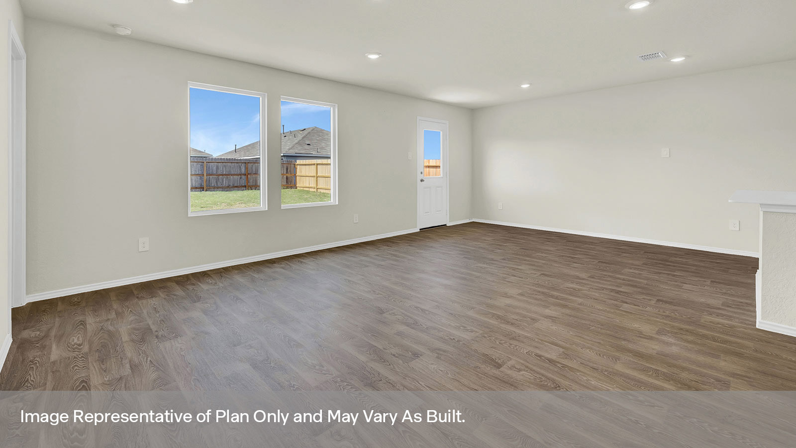 Living room with vinyl flooring, two windows, and a half lite exterior door.