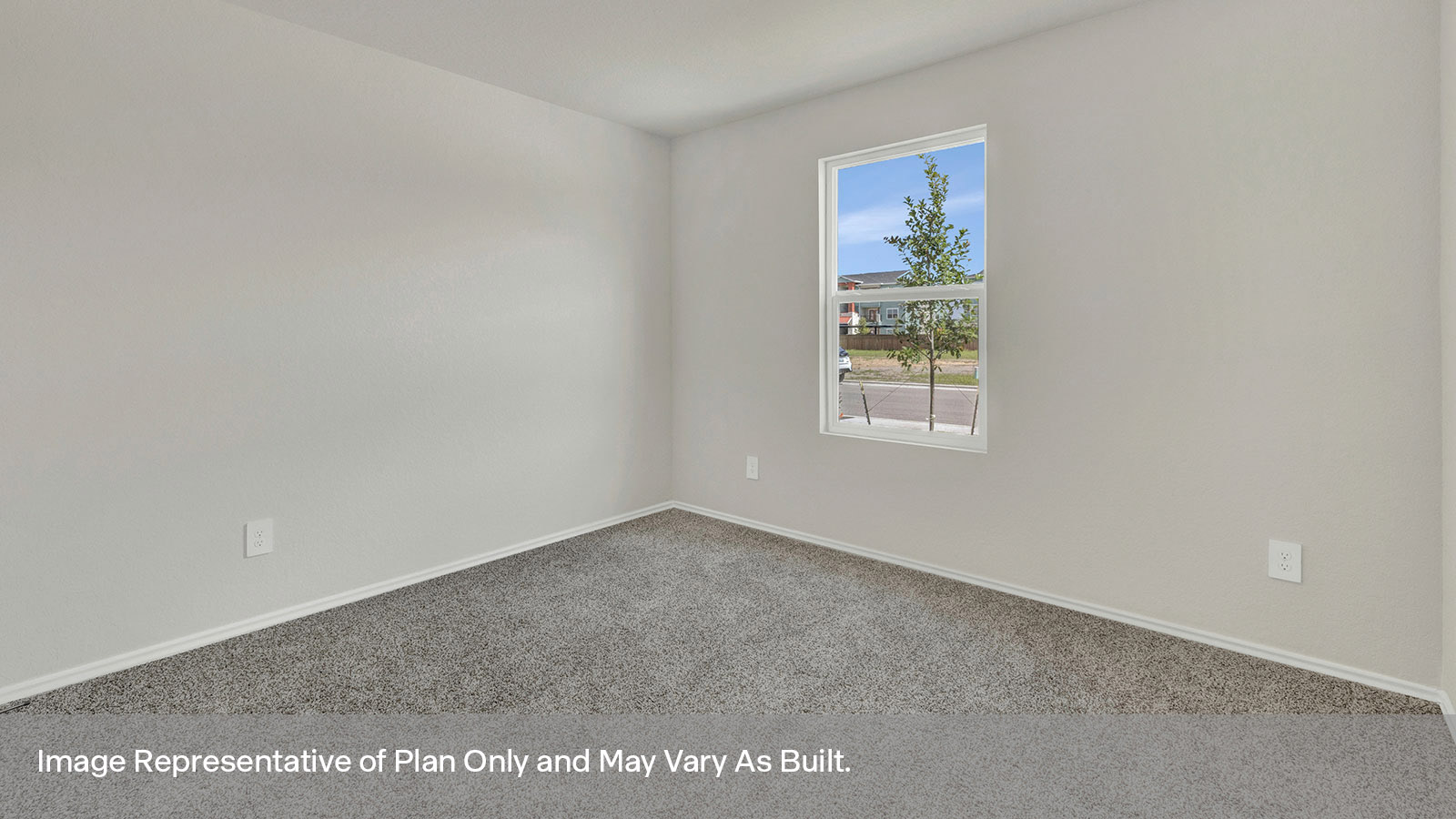 Front bedroom with carpeting and one window.