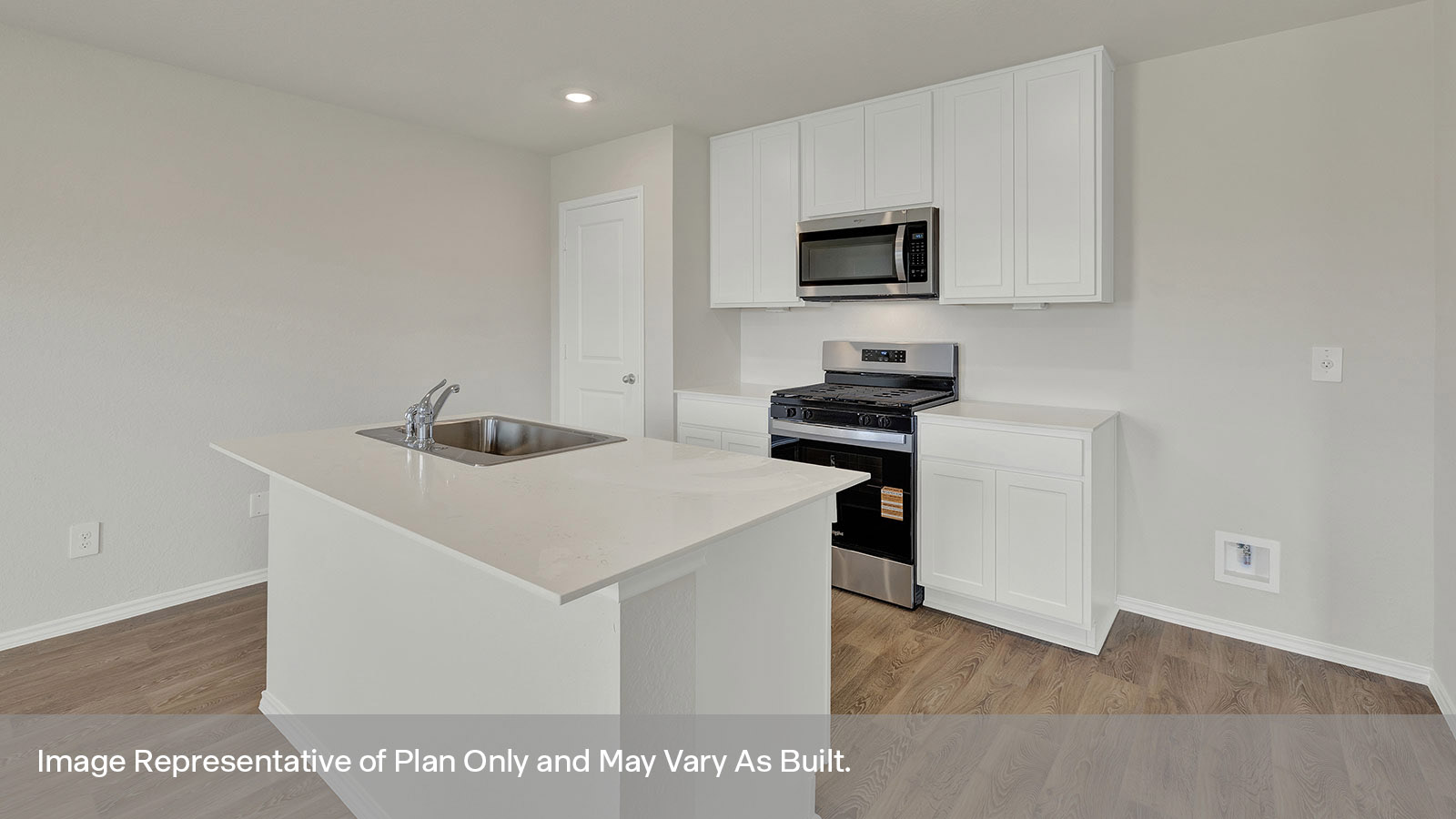 Kitchen with kitchen island and white cabinets.