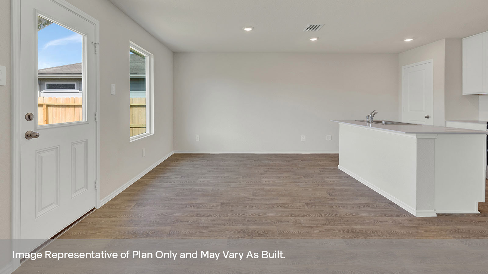 Dining room with vinyl flooring, one window, and a half lite exterior door.