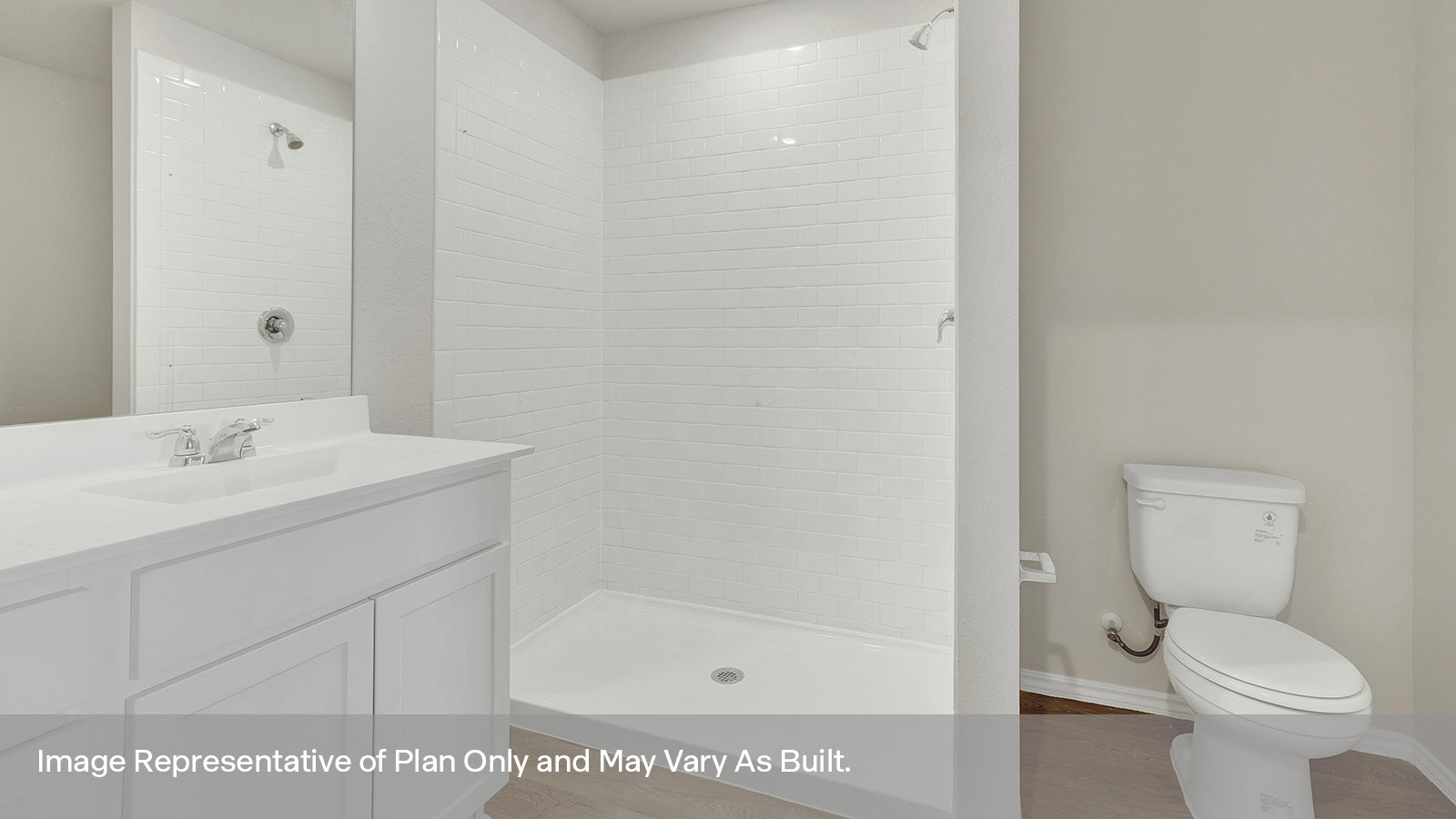 Main bathroom with vanity, shower, and toilet.