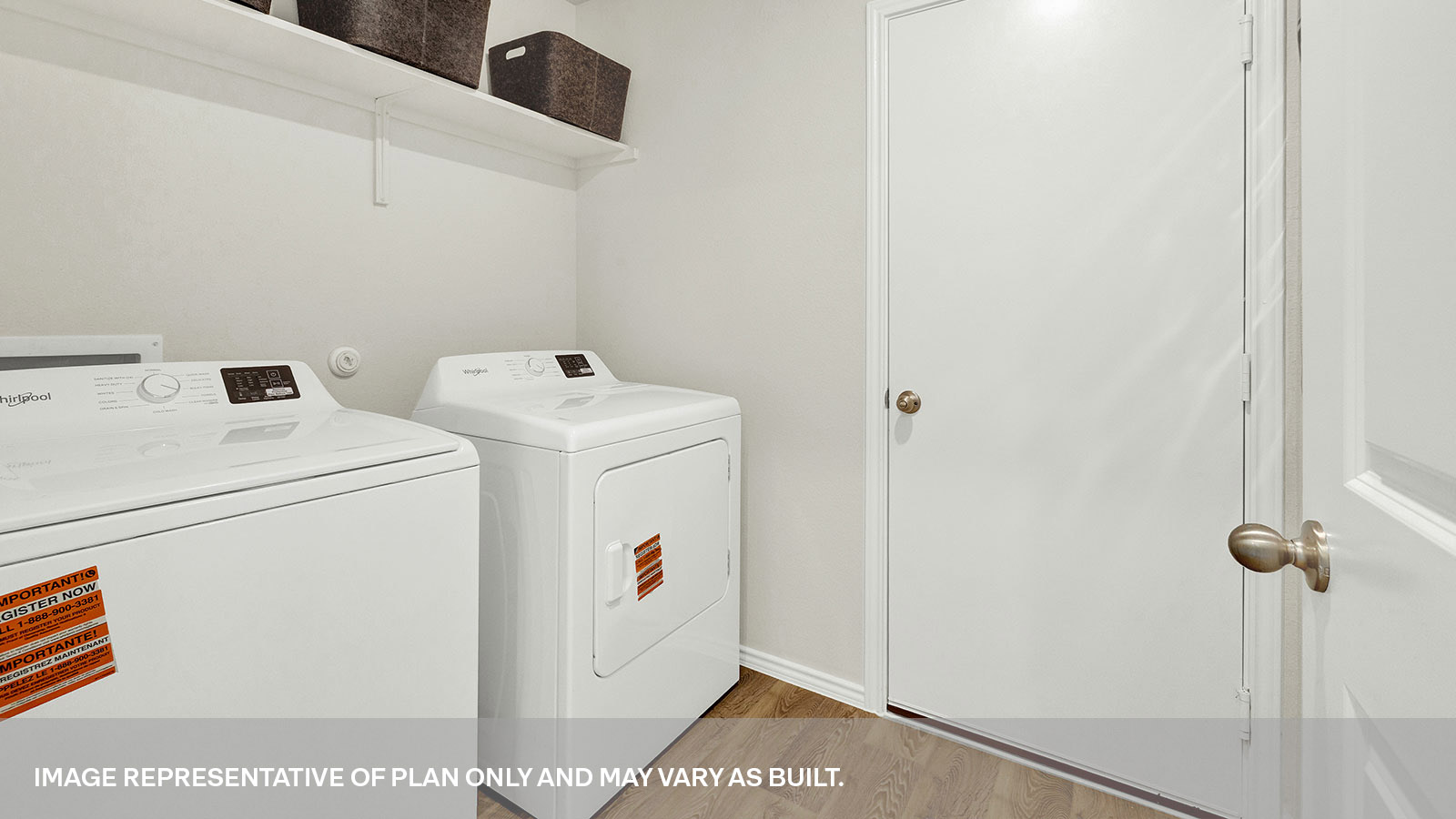 Laundry room with washer/dryer connections and wooden shelving.