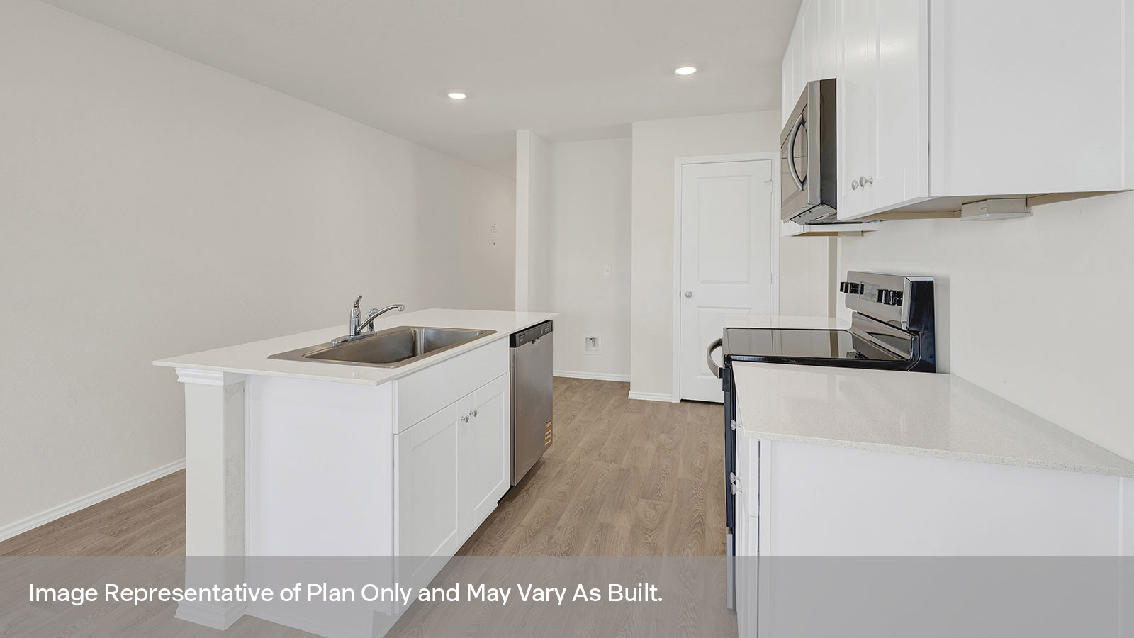 Kitchen with kitchen island and quartz countertops.
