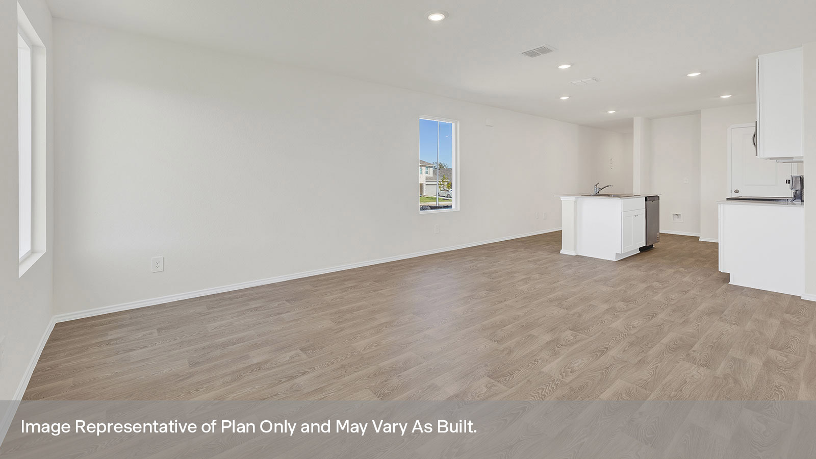 Kitchen with kitchen island overlooking the dining room and living room.