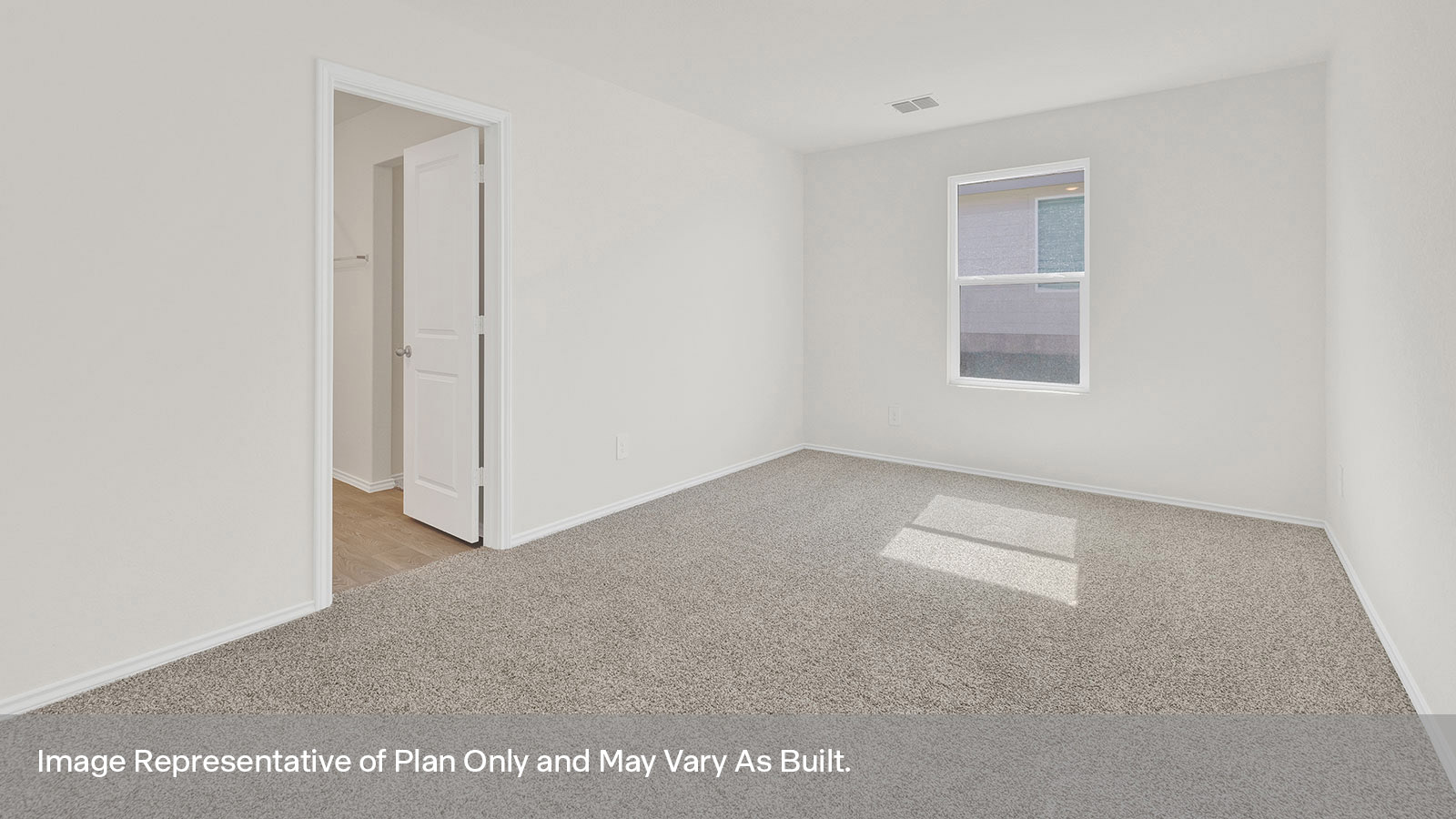 Main bedroom with carpeting and one window.