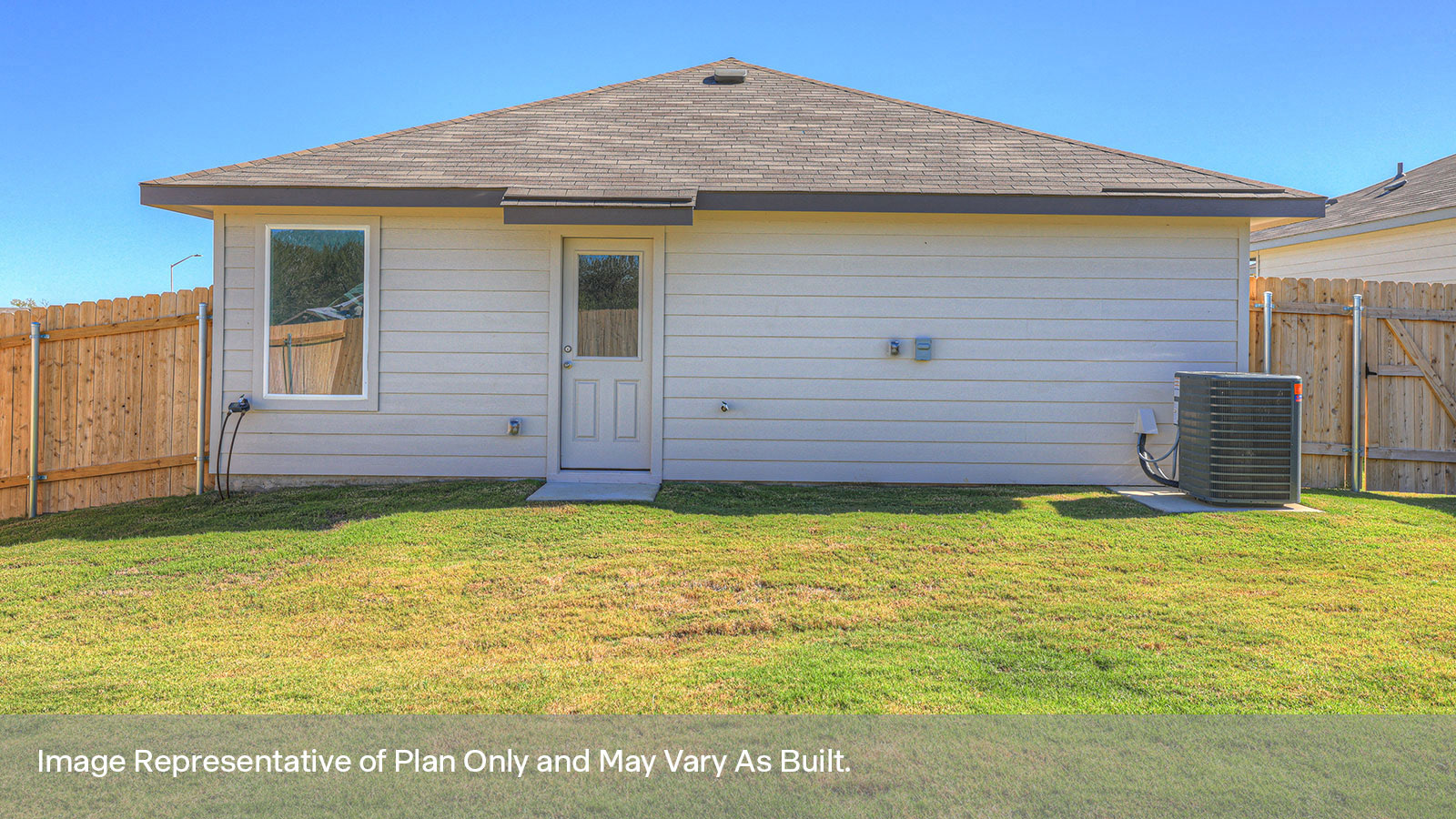 Backyard with sod and privacy fence.