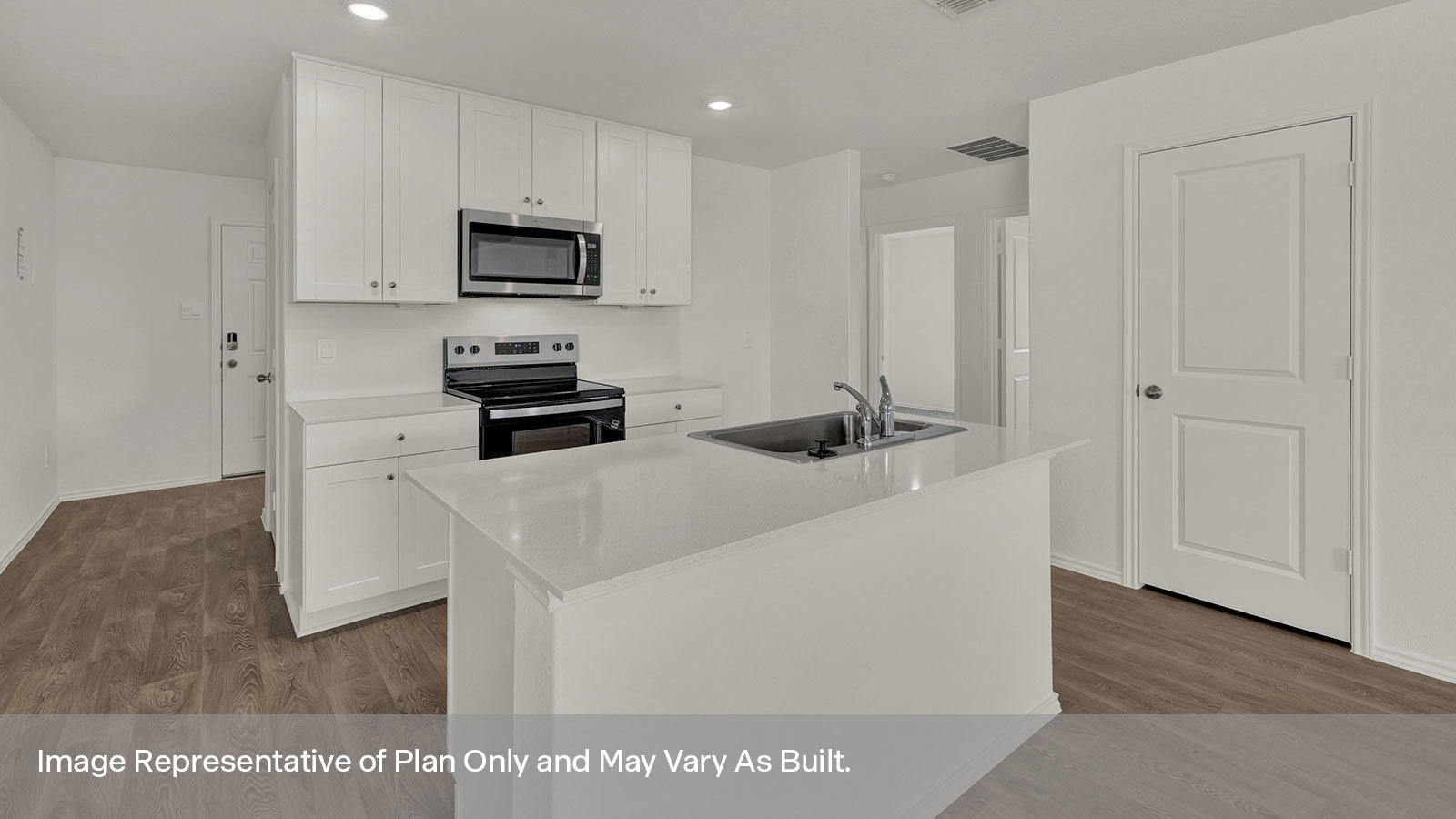 Kitchen with kitchen island and quartz countertops.