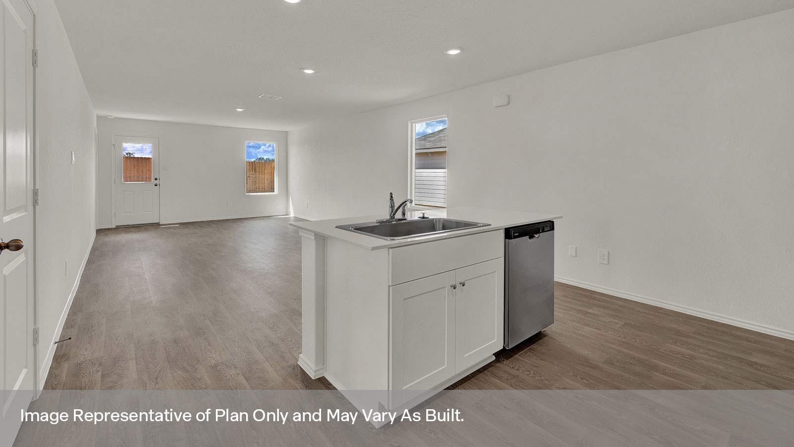 Kitchen with kitchen island and quartz countertops.