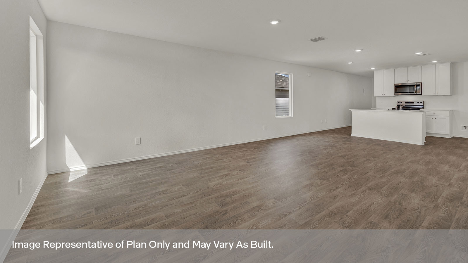 Dining room and living room with vinyl flooring and two windows.