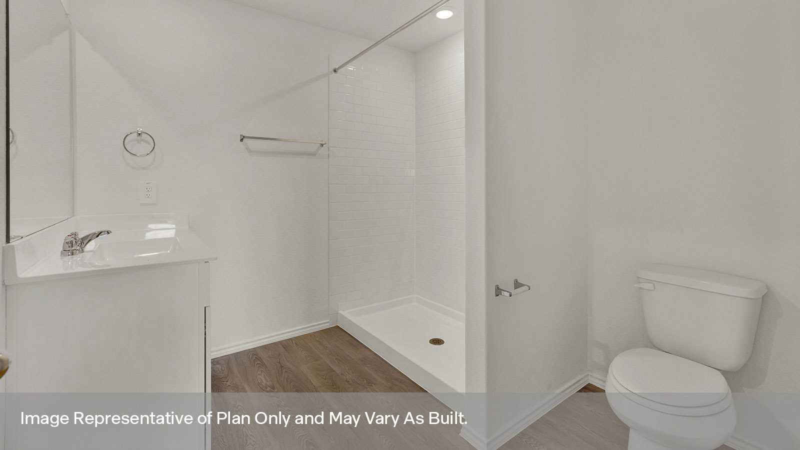 Main bathroom with single sink vanity, toilet, and tile shower.