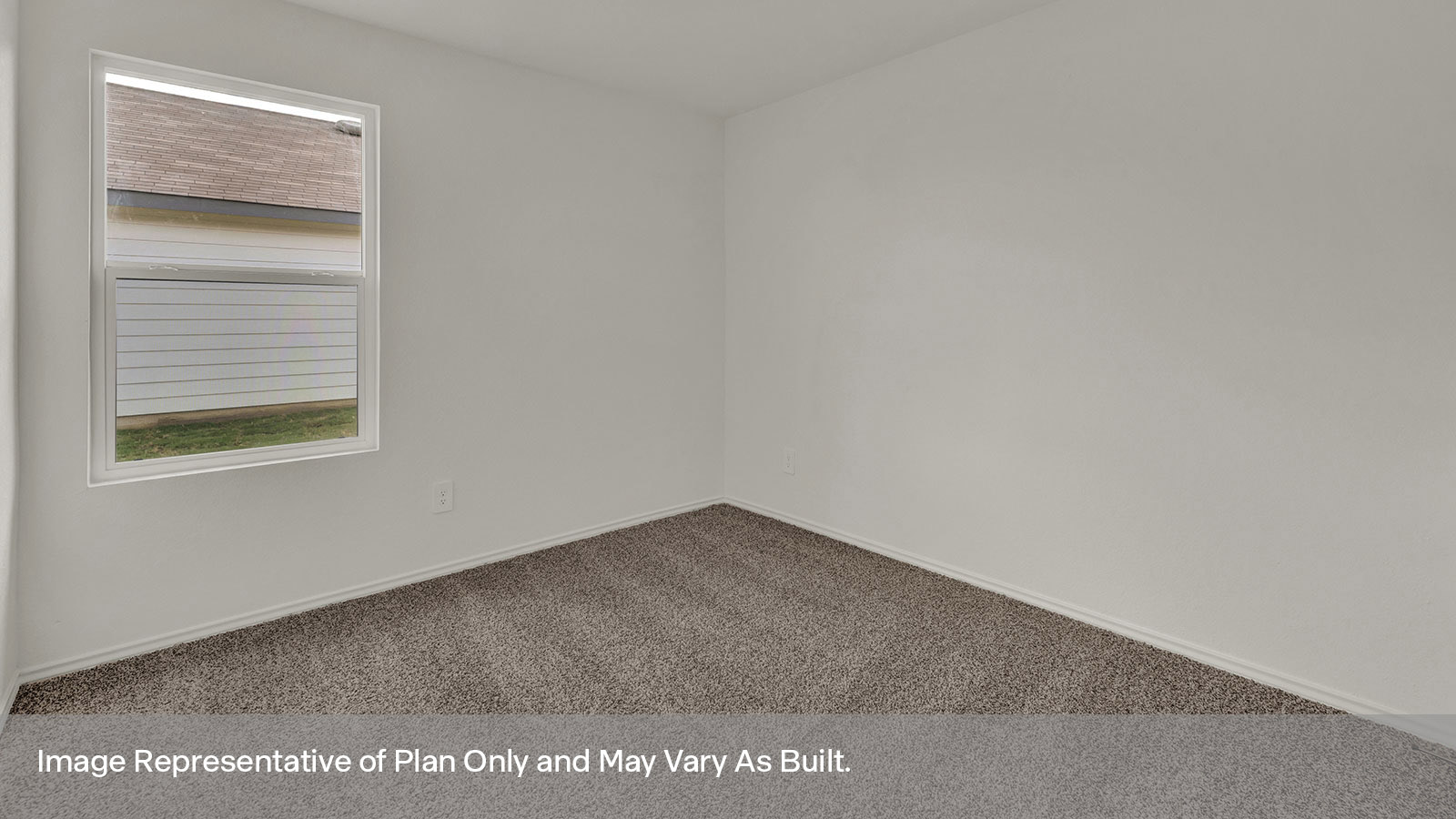 Secondary bedroom with carpeting and bathroom entry.