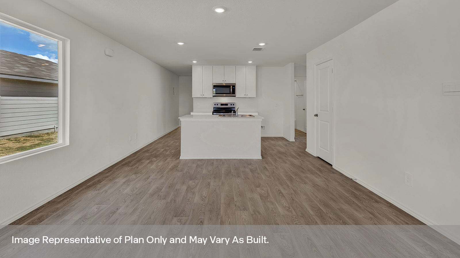 Dining room and living room with vinyl flooring and two windows.