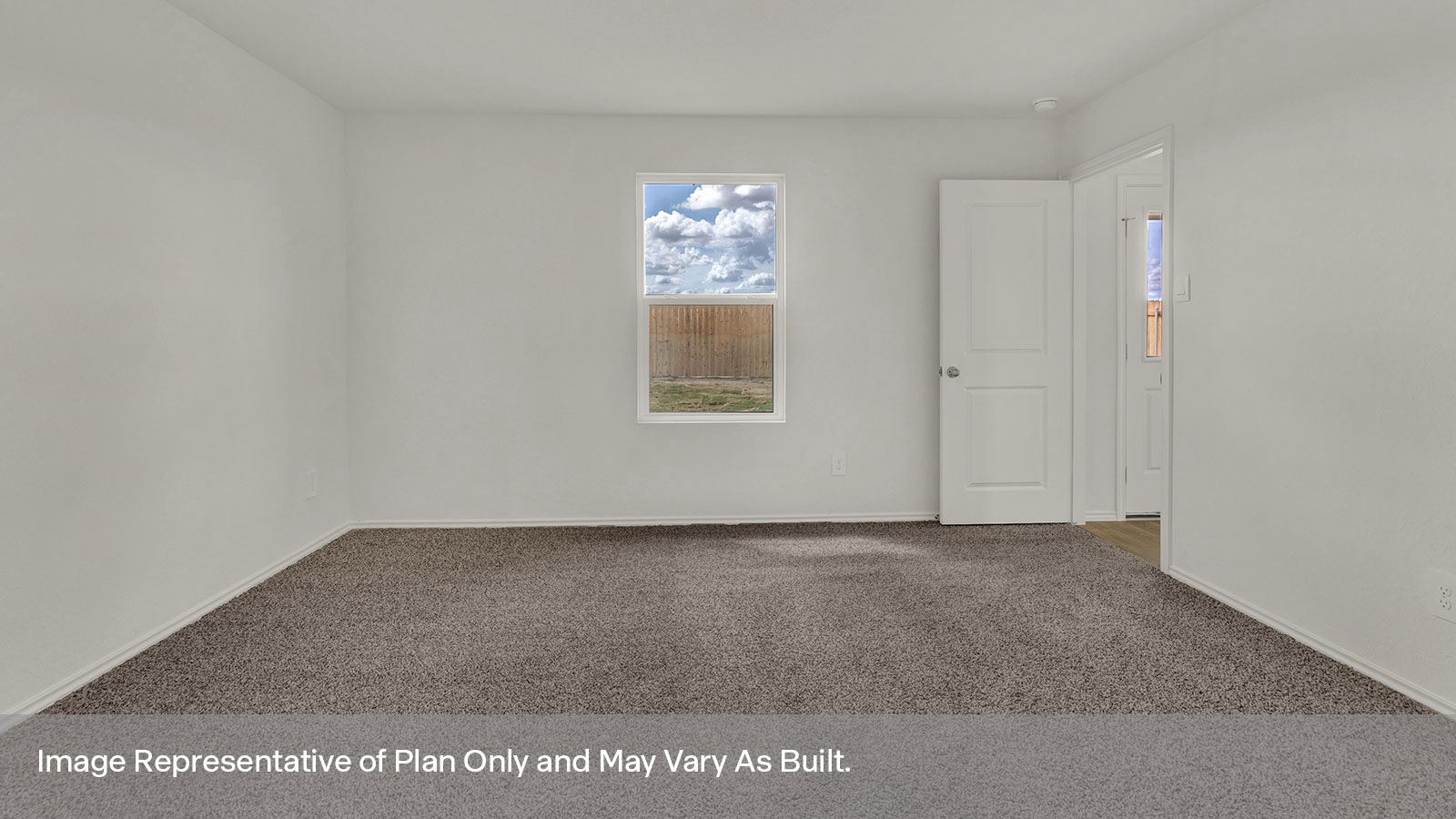 Main bedroom with carpeting and one window.