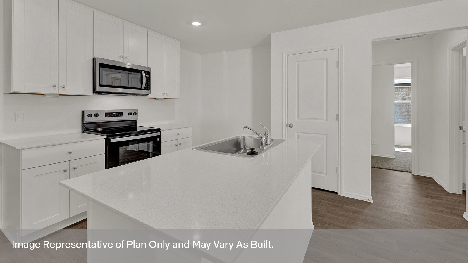 Kitchen with kitchen island and sink.