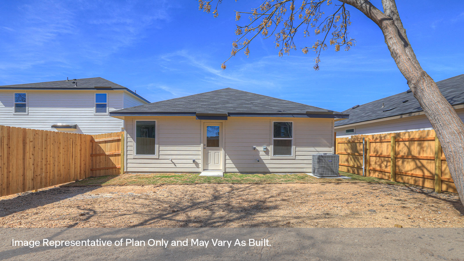 Backyard with sod and privacy fence.