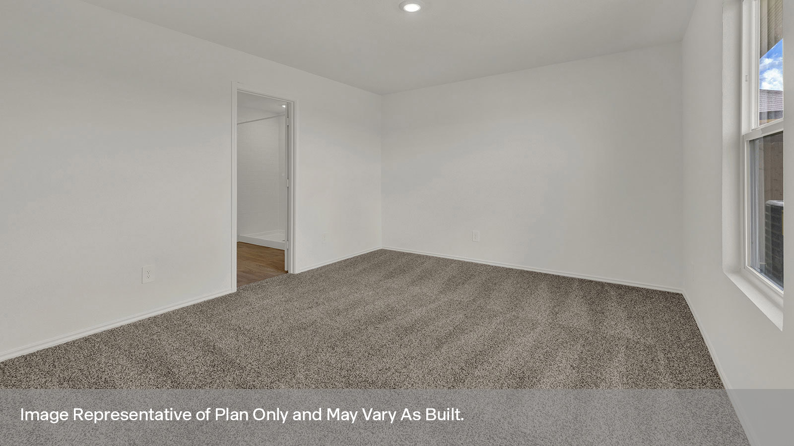 Main bedroom with carpeting and one window.