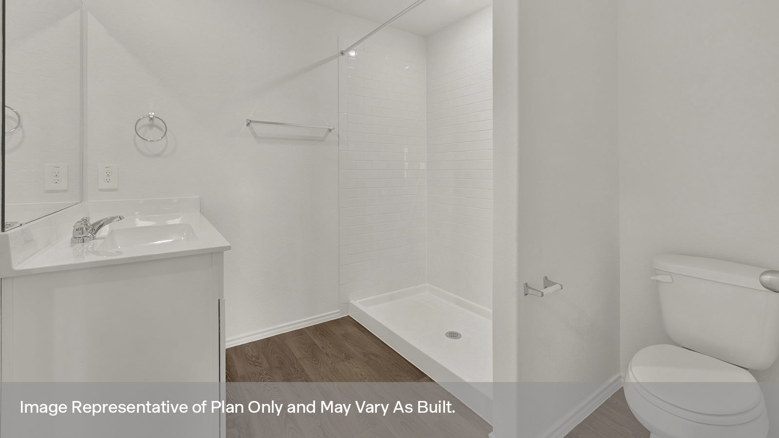 Main bathroom with vanity, toilet, and shower with tile.