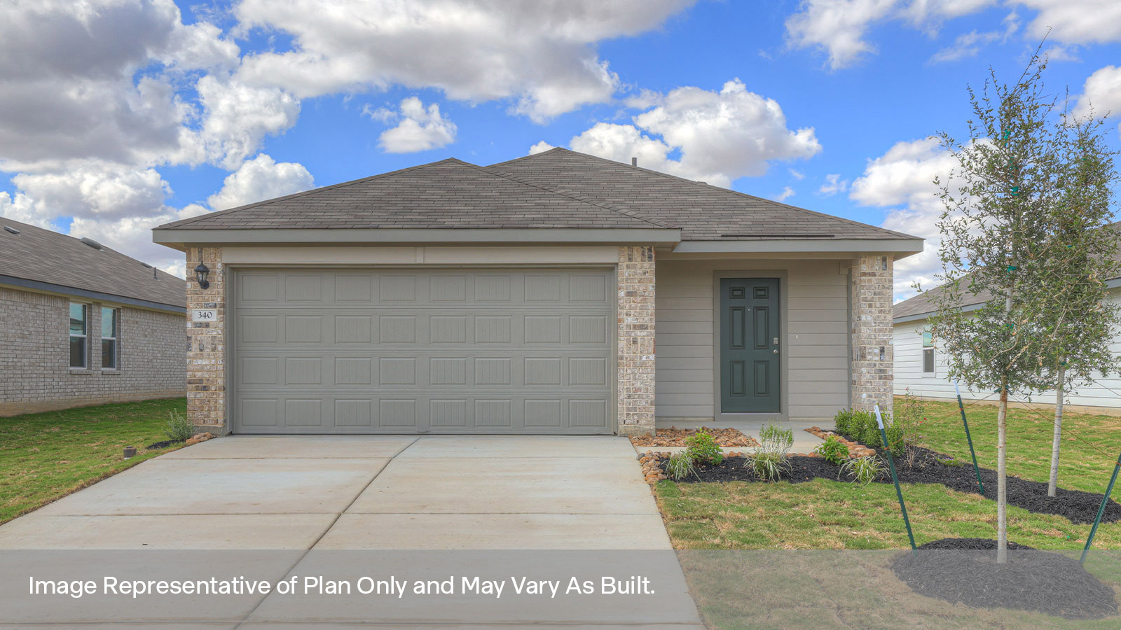 Single-story masonry exterior with a 2-car garage.