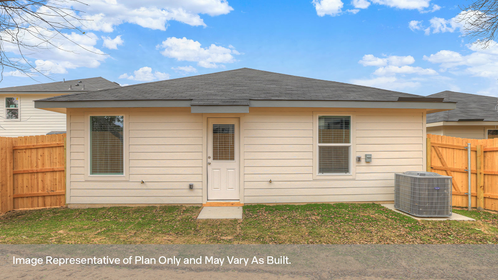 Backyard with 2 windows, and a half lite exterior door.