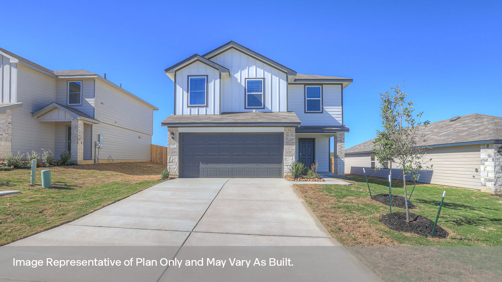 Two-story farmhouse exterior photo with 2 car garage.