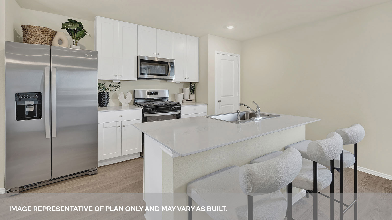 Kitchen with kitchen island and white cabinets.