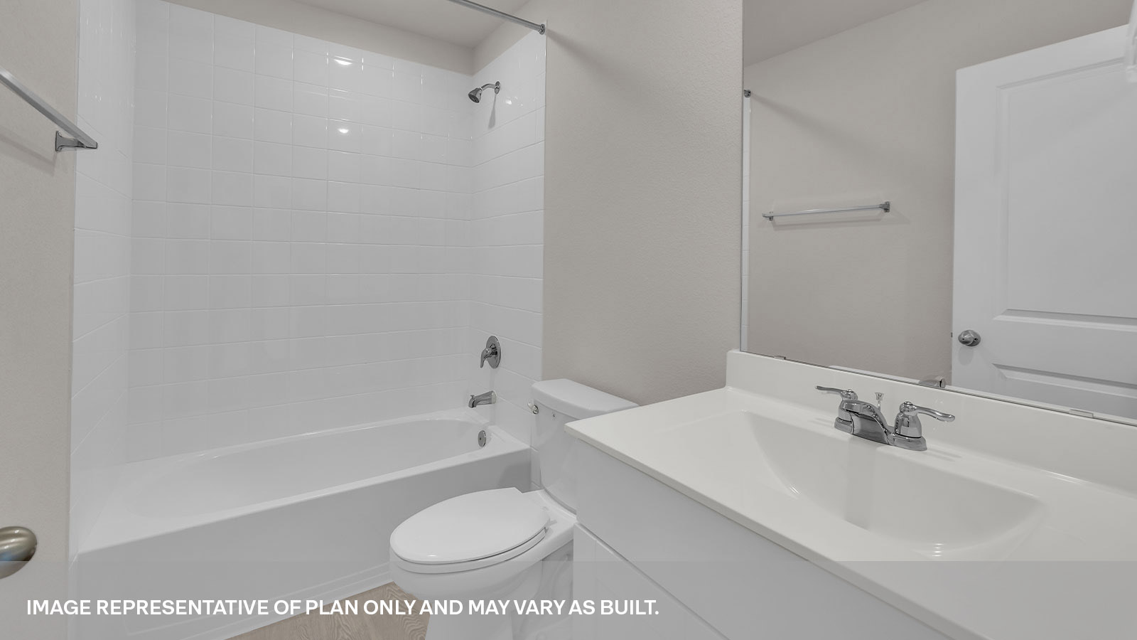 Hall bathroom with tub with tile surround, toilet, and single-vanity sink.