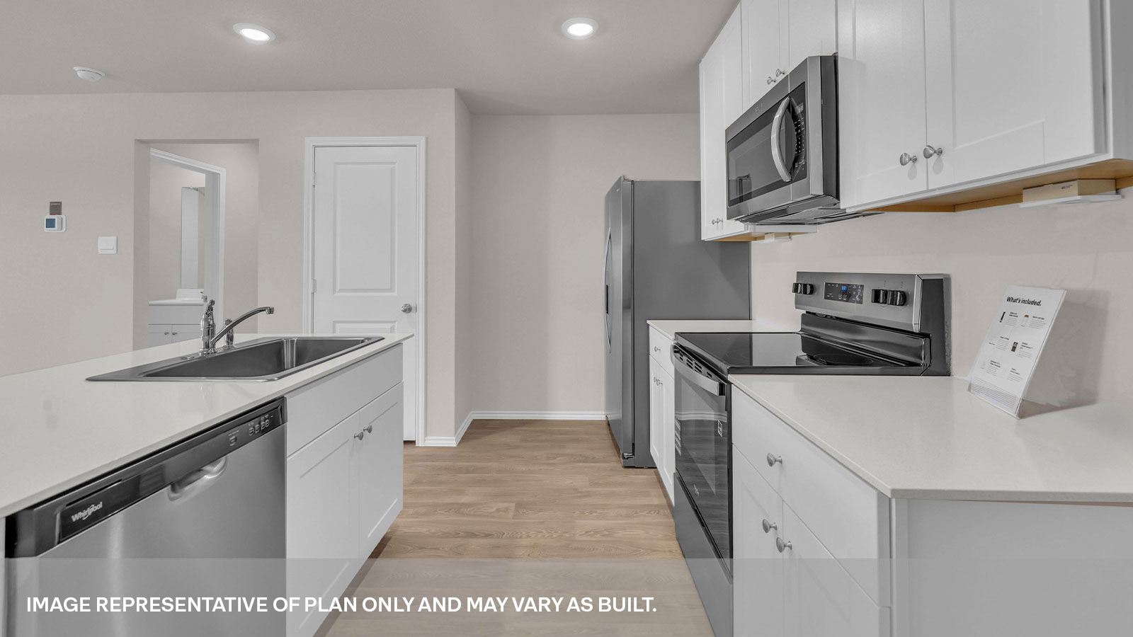 Kitchen with kitchen island and quartz countertops.