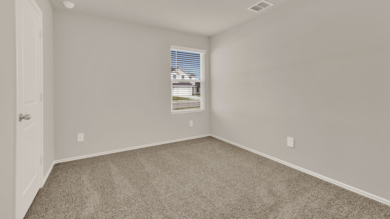 Secondary bedroom with carpeting and one window.