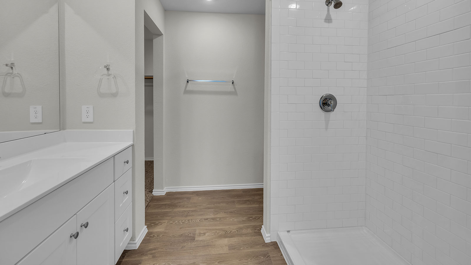 Main bathroom with vanity and shower.