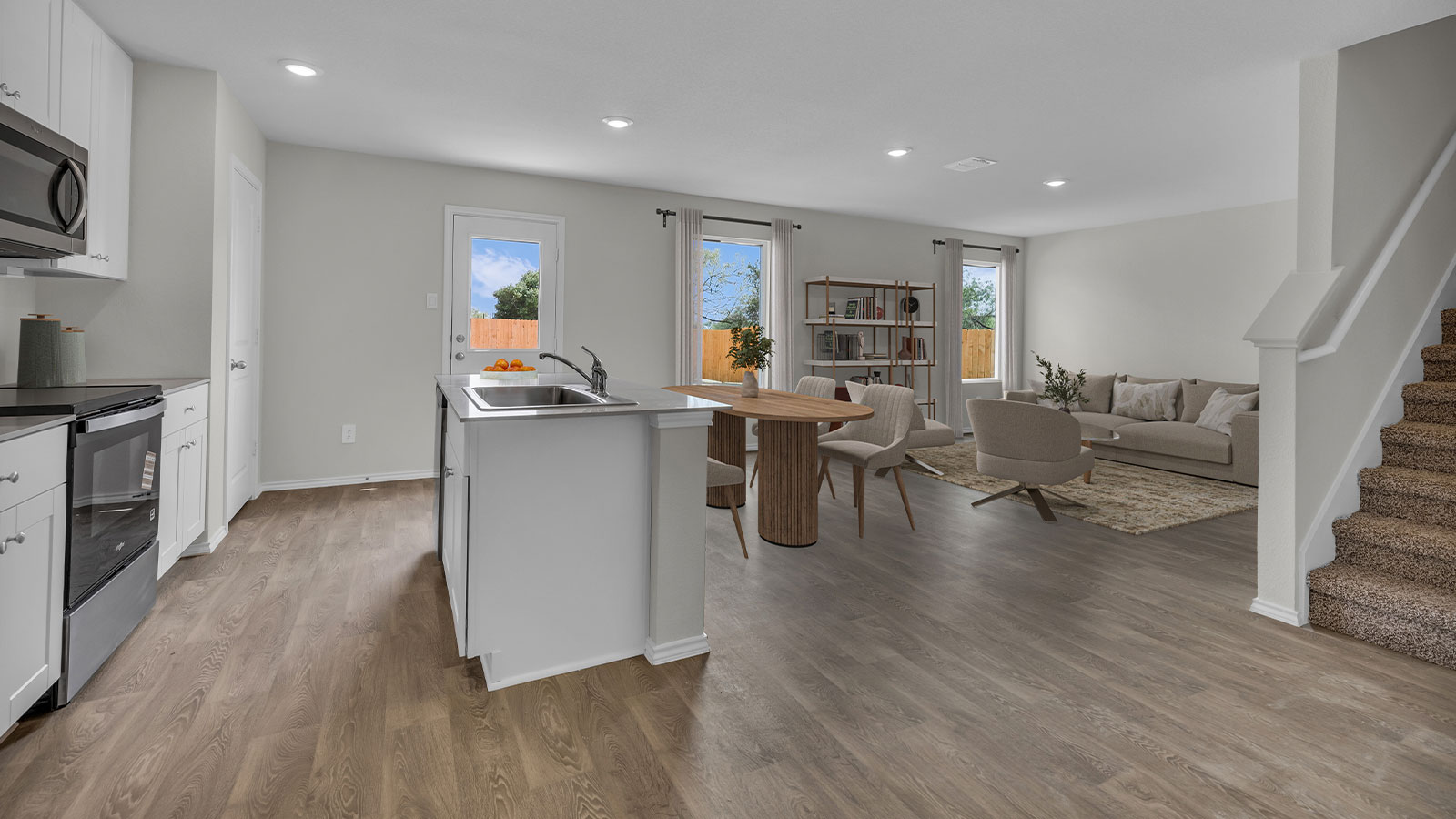 Virtually staged dining room and living areas.