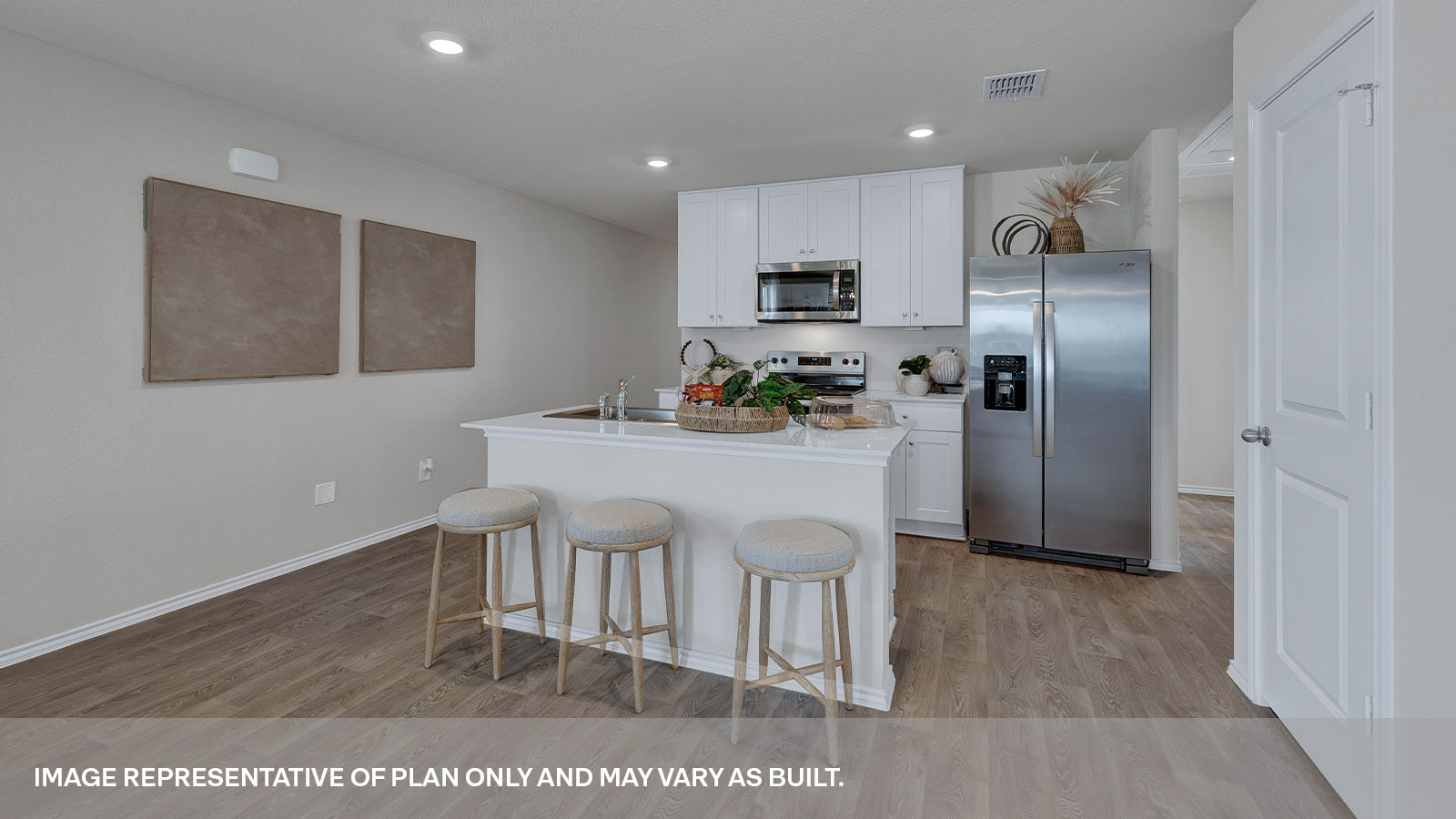 Kitchen with kitchen island and white cabinets.