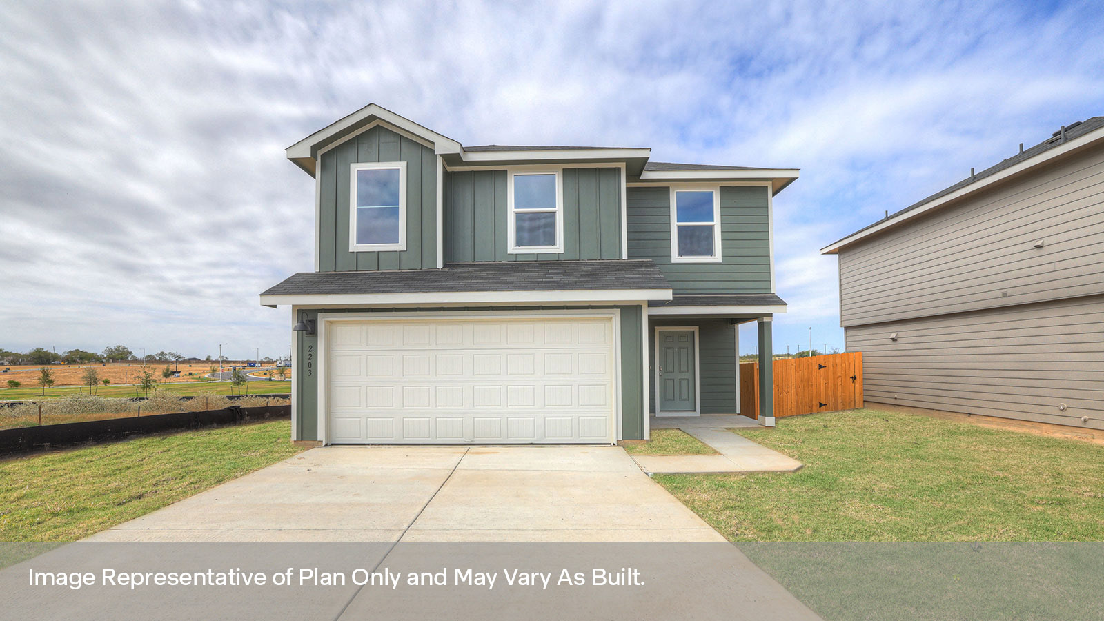 Two-story farmhouse exterior photo with 2 car garage.