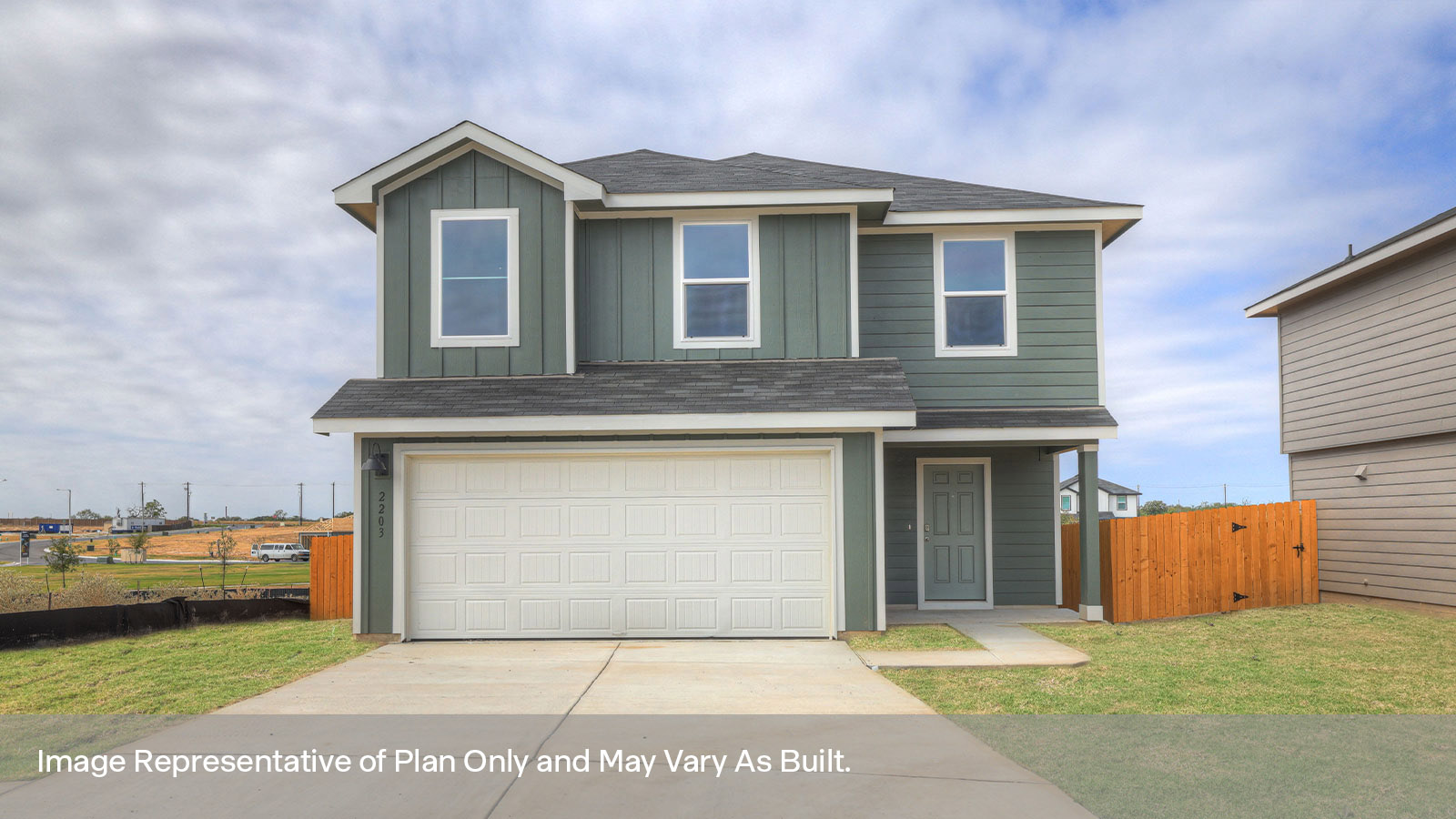 Two-story farmhouse exterior photo with 2 car garage.