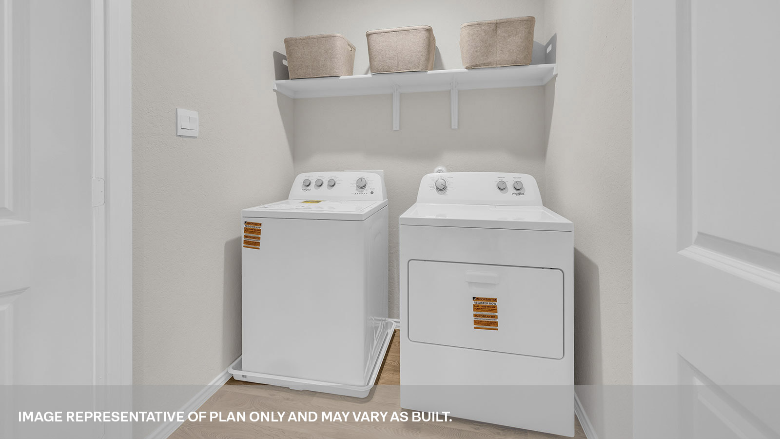 Laundry room with washer/dryer connections and wooden shelving.
