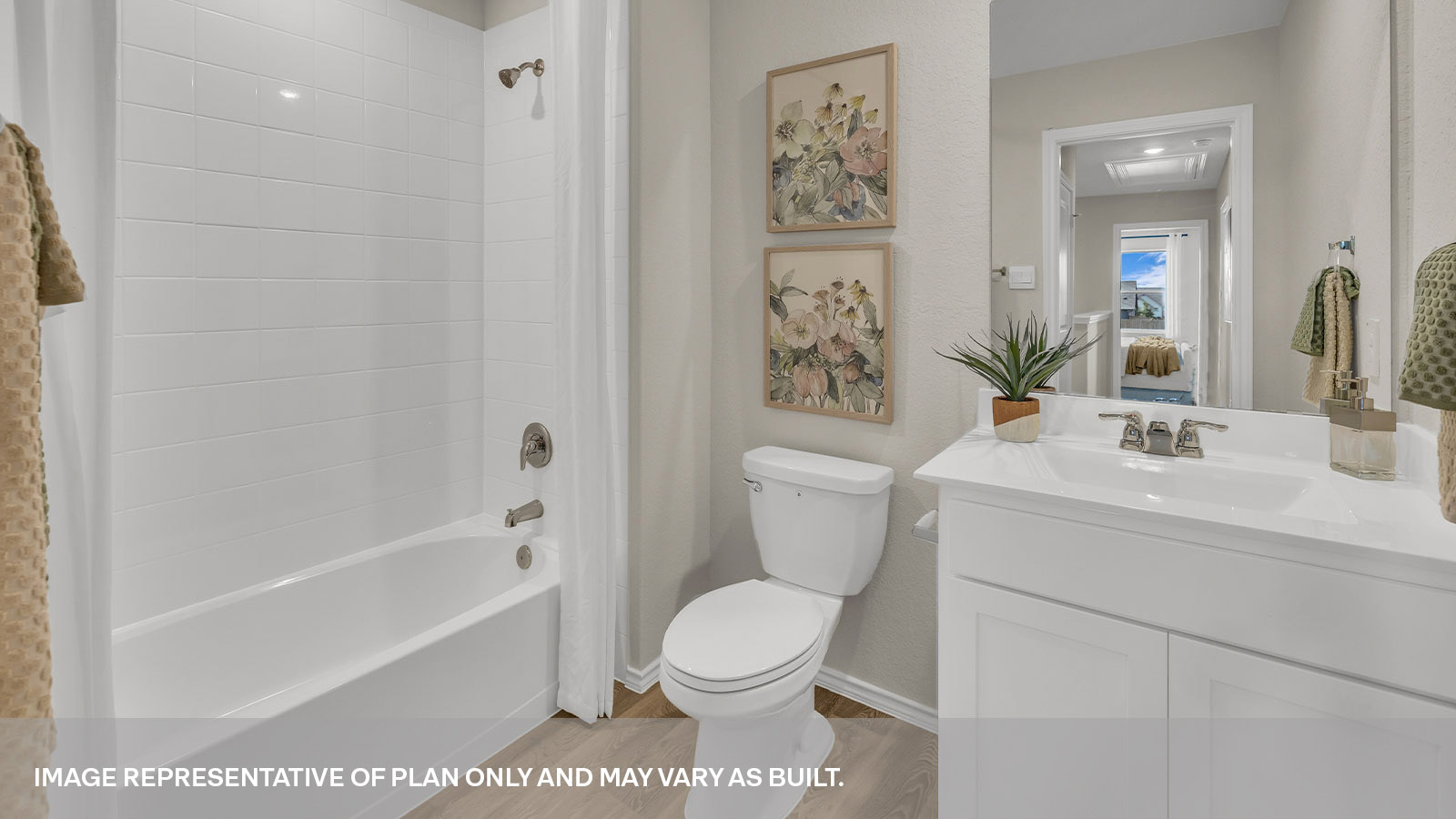 Secondary bathroom with vanity and shower/tub combination.