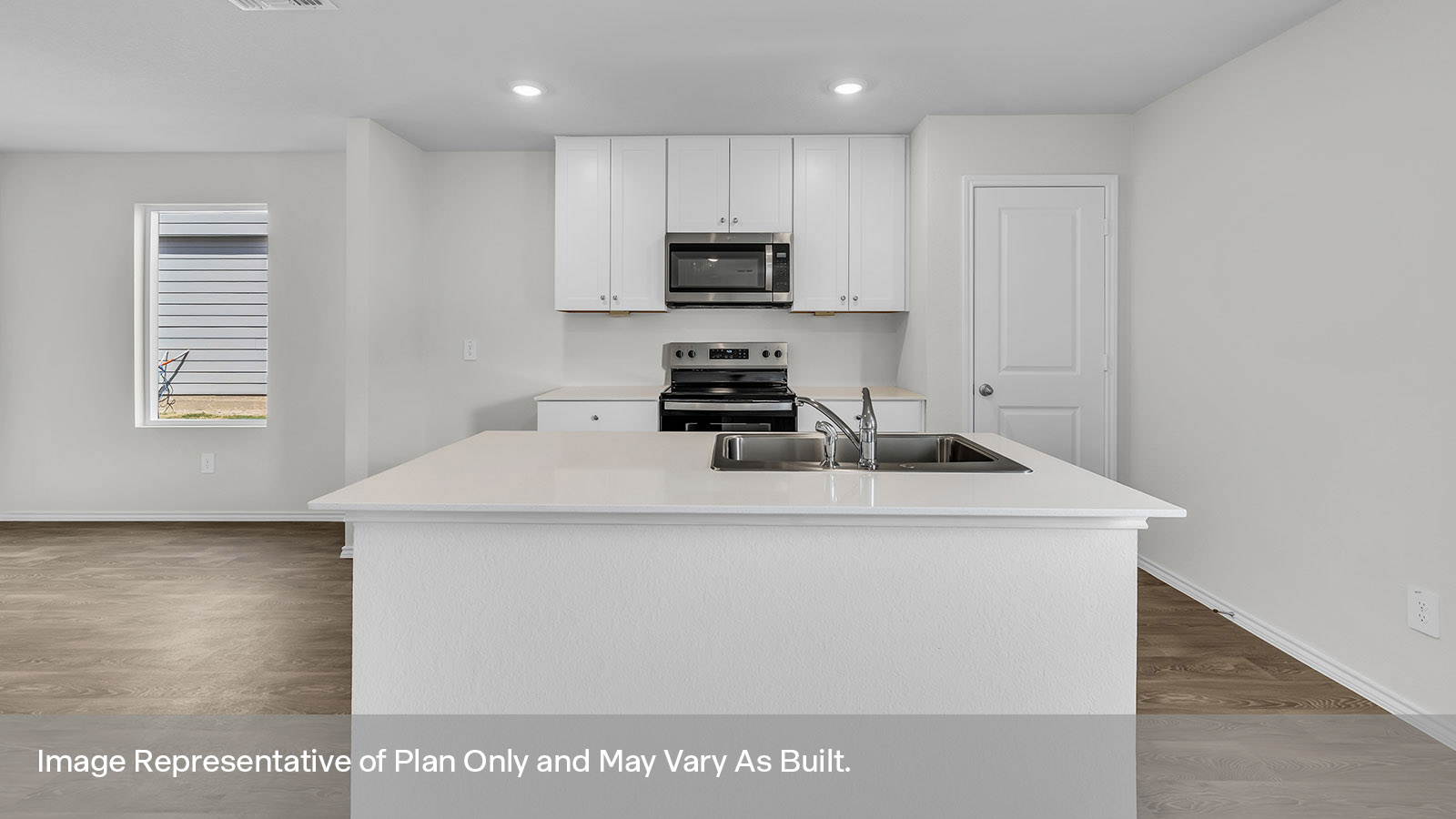 Kitchen with kitchen island and white cabinets.