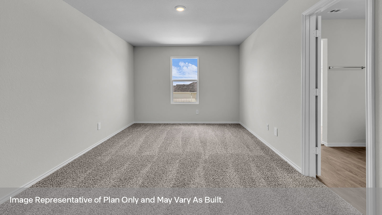 Main bedroom with carpeting and one window.
